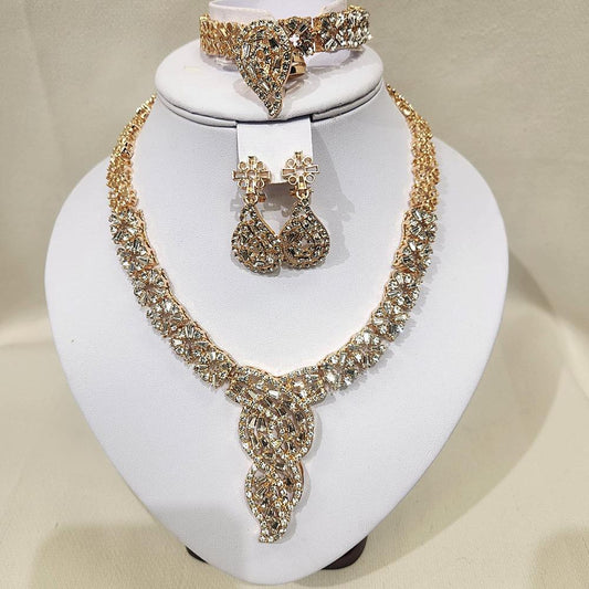 Stylish five piece gold jewelry set with multi cut stones