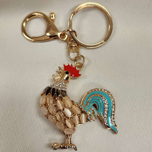 Full view of colorful rooster shaped purse charm 