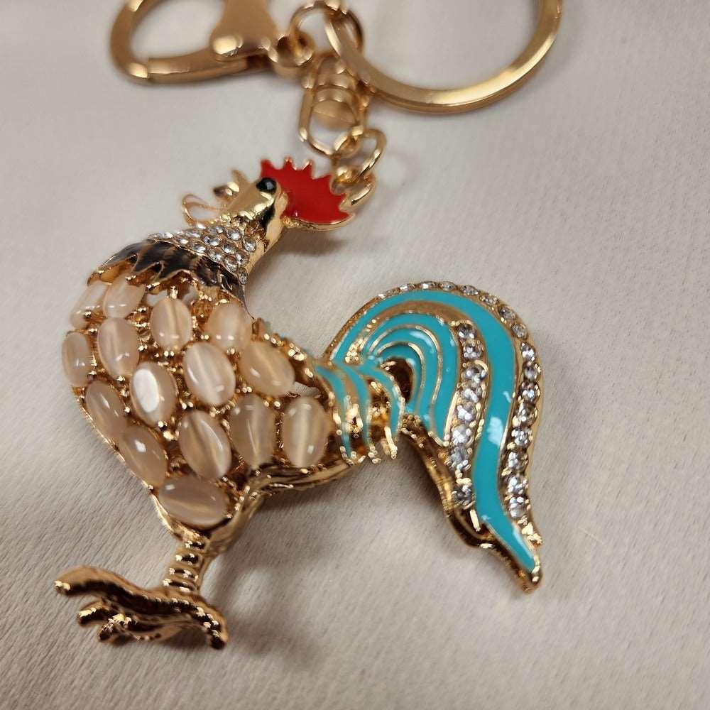 Detailed view of colorful rooster shaped purse charm 