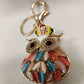 Detailed view of Colorful owl shaped purse charm