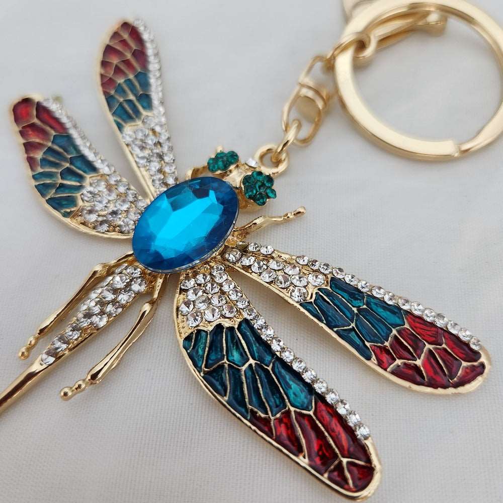 Detailed view of Colorful fire fly shaped purse charm 