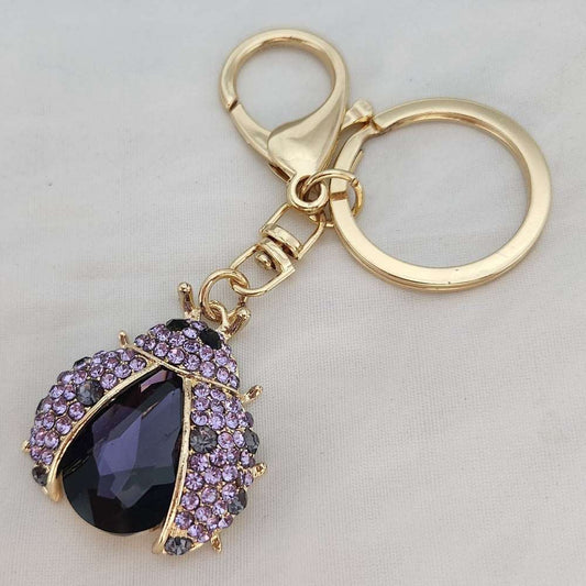 Beatle shaped stone studded purse charm