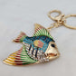 Alternative view of colorful stone studded fish shaped purse charm