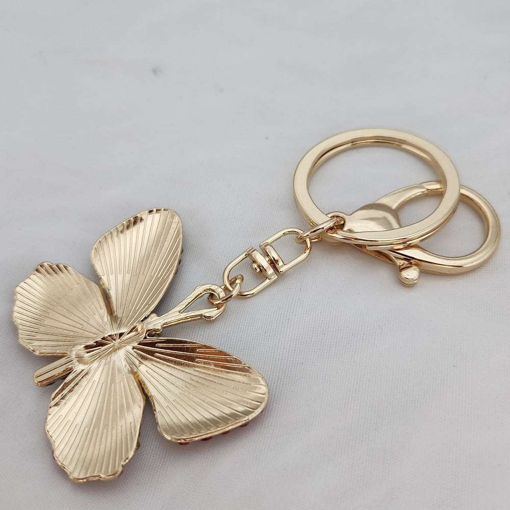 Bright colorful butterfly shaped purse charm when reversed
