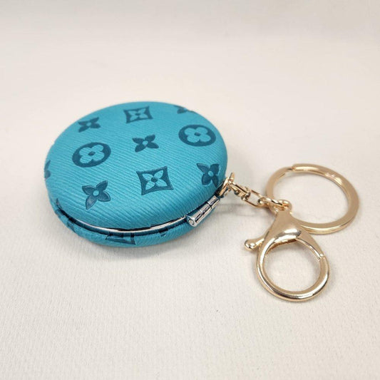 Turquoise Pocket mirror with engraved floral pattern and a keyring when closed