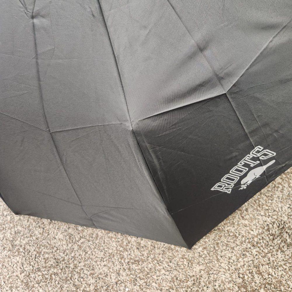 Roots Logo on the extended coverage umbrella in black