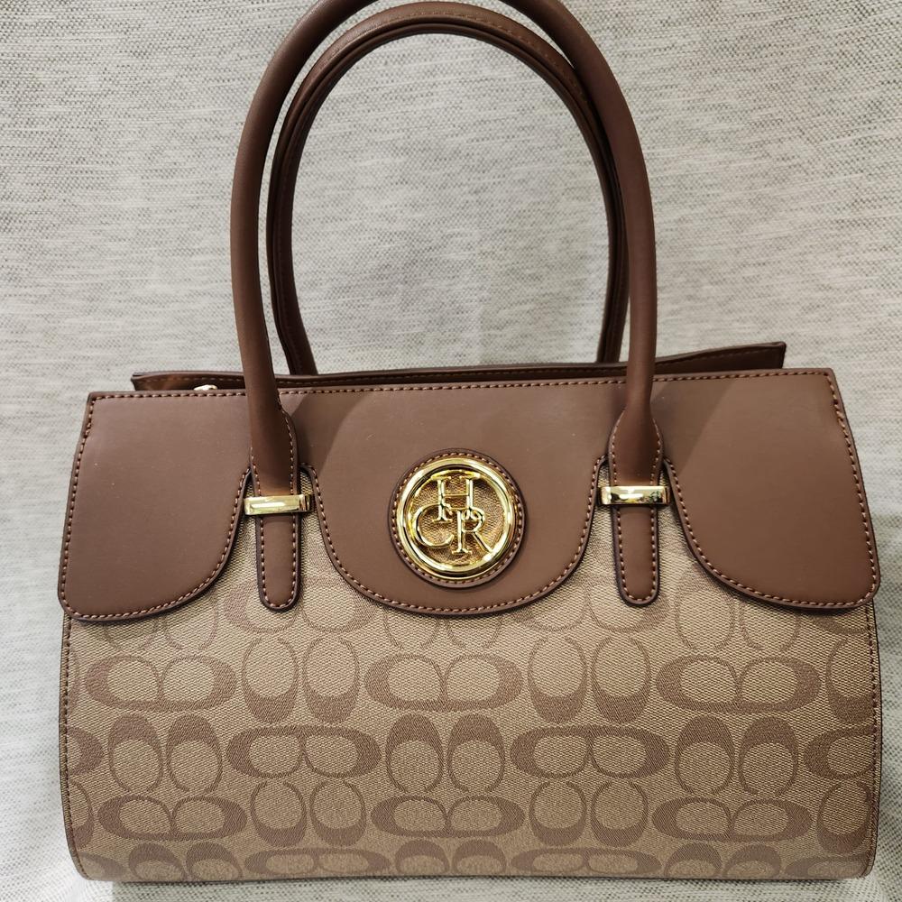 Detailed view of Printed handbag with brown top handle 