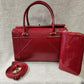 Another view of Red patent Fold-top handbag with matching wallet
