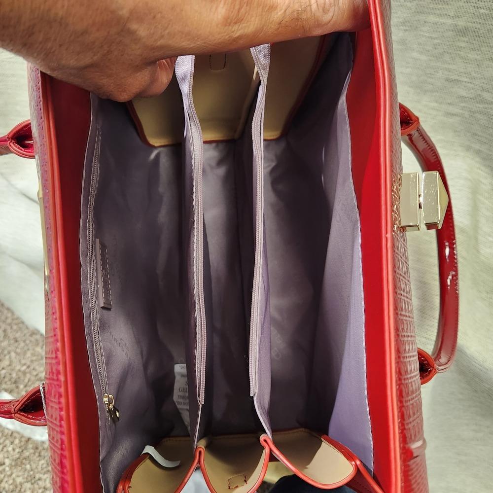 Inside view of Red patent Fold-top handbag
