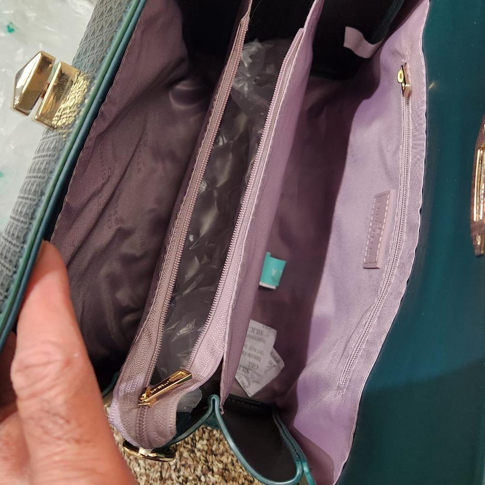 Inside view of Green patent Fold-top handbag