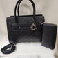 Another view of Elegant black textured handbag with wallet