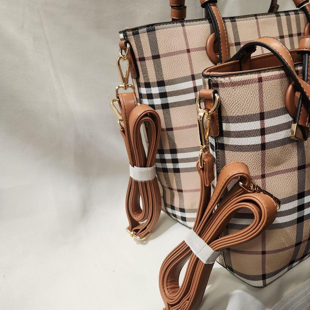 Detailed view of Plaid pattern dual handbag set with tan handle