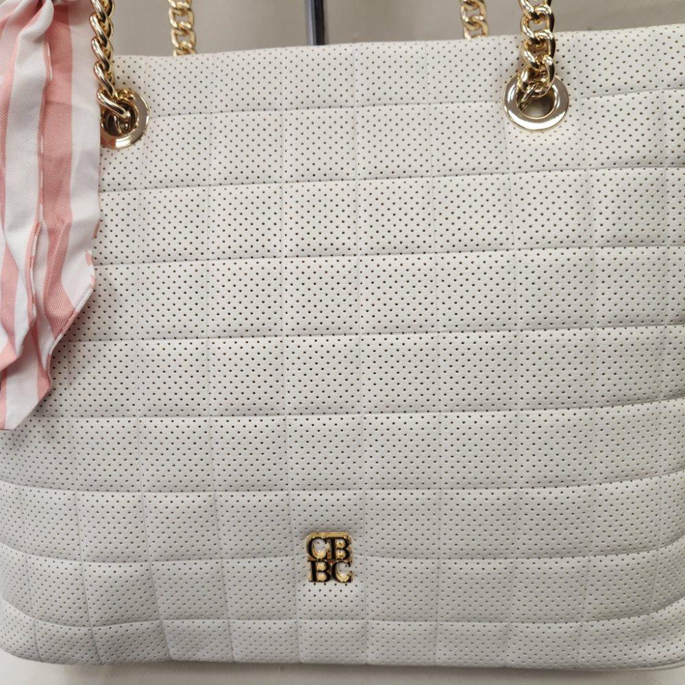 Front view of elegant off white handbag