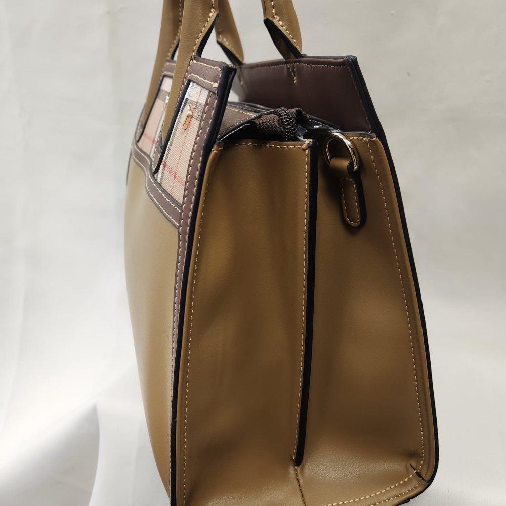 Side view of Mud color handbag with brown trim and wallet