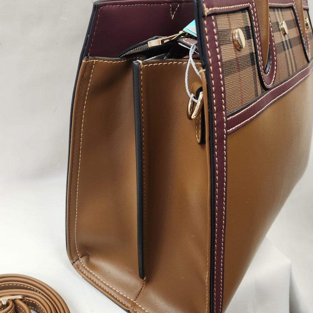 Side view of Coffee color handbag with burgundy trim
