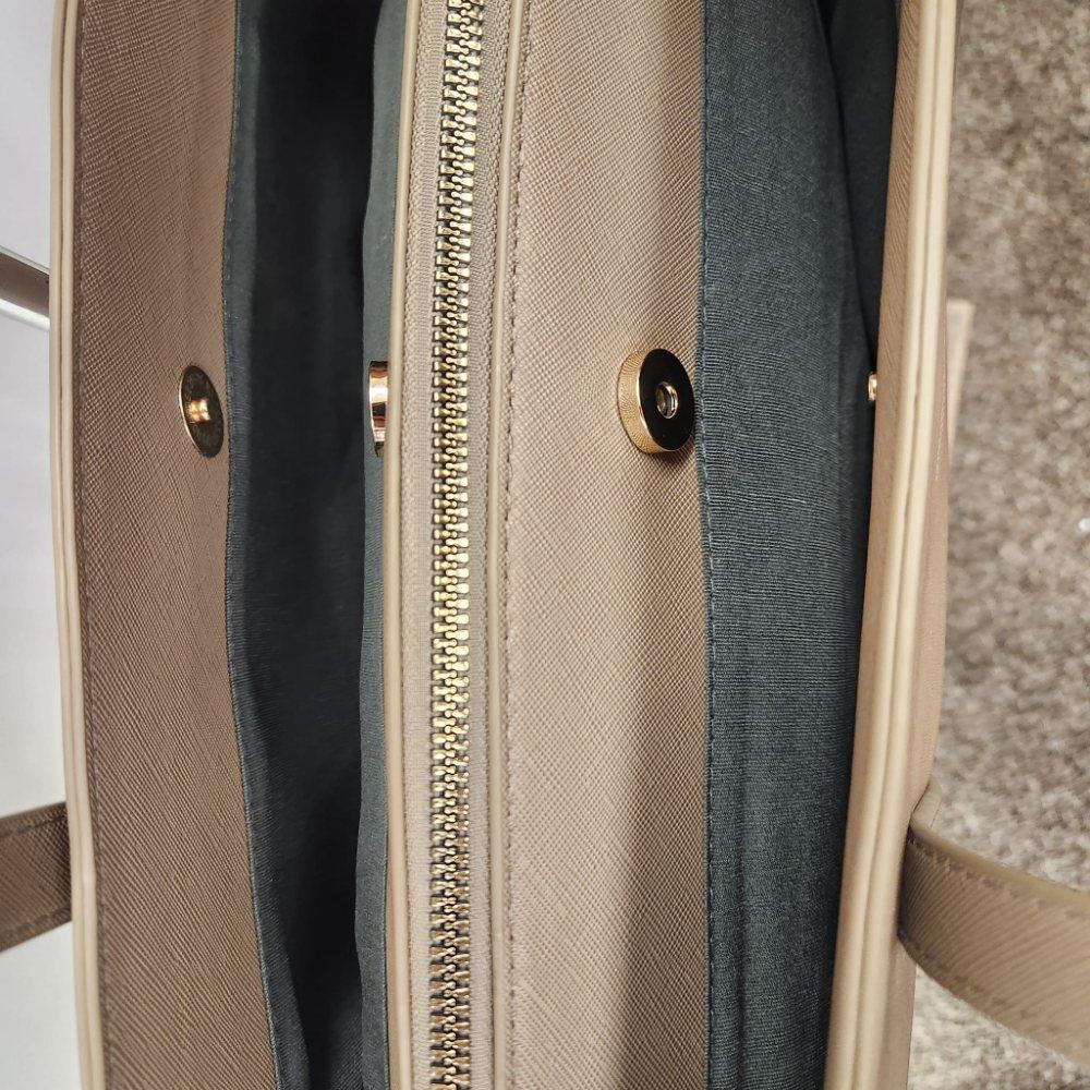 Three main pockets of taupe colored David Jones handbag