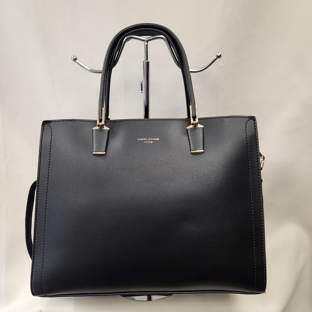 Mid size black colored handbag