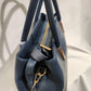 Side view of Mid size blue colored handbag