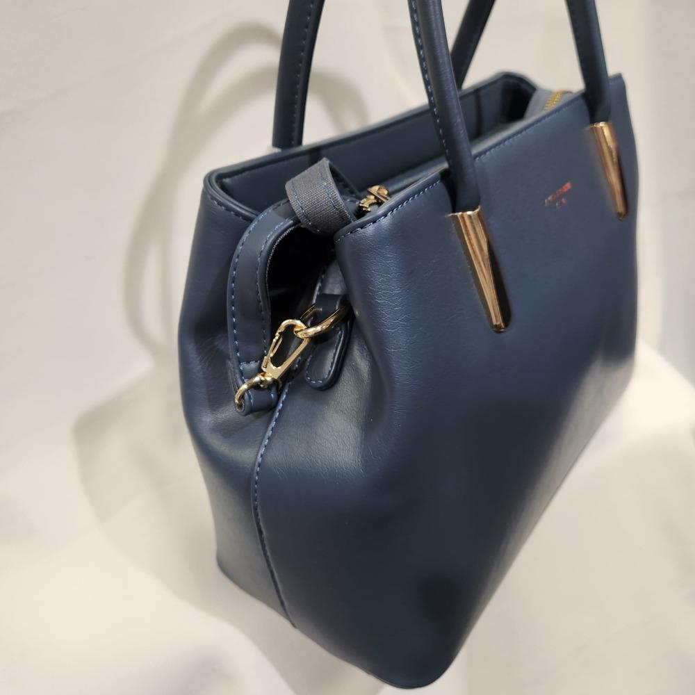 Side view of Mid size blue colored handbag