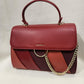 Elegant red color graded handbag