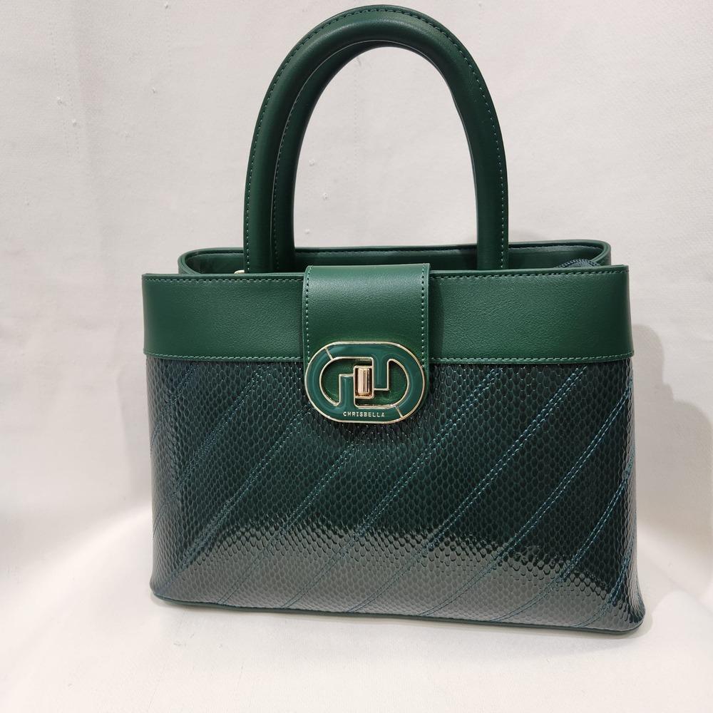 View of Mid size green patent front handbag 