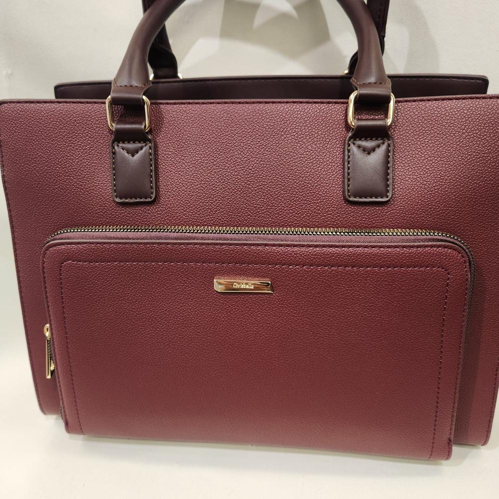 Front zipped pocket of burgundy handbag