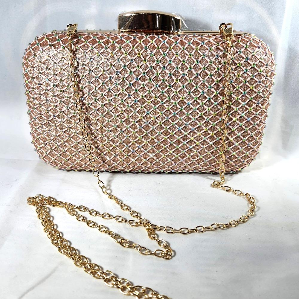Long gold chain strap of peach pink party purse with AB stones
