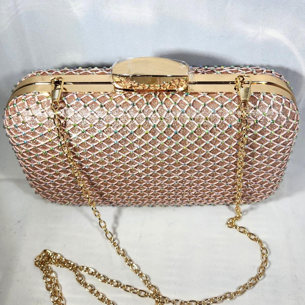 Gold color clasp on peach pink party purse