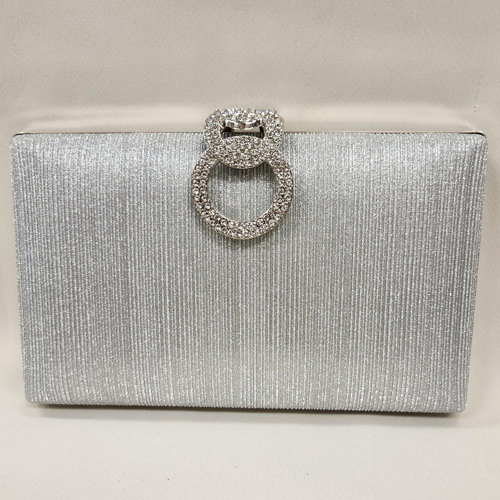 Elegant silver party purse with decorative clasp closure