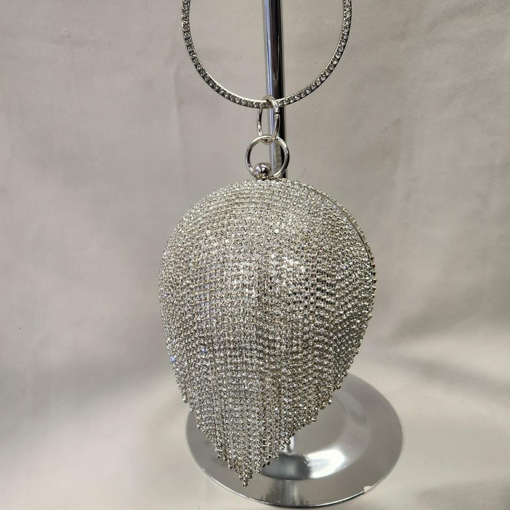 Another front view of Silver globe shaped party purse
