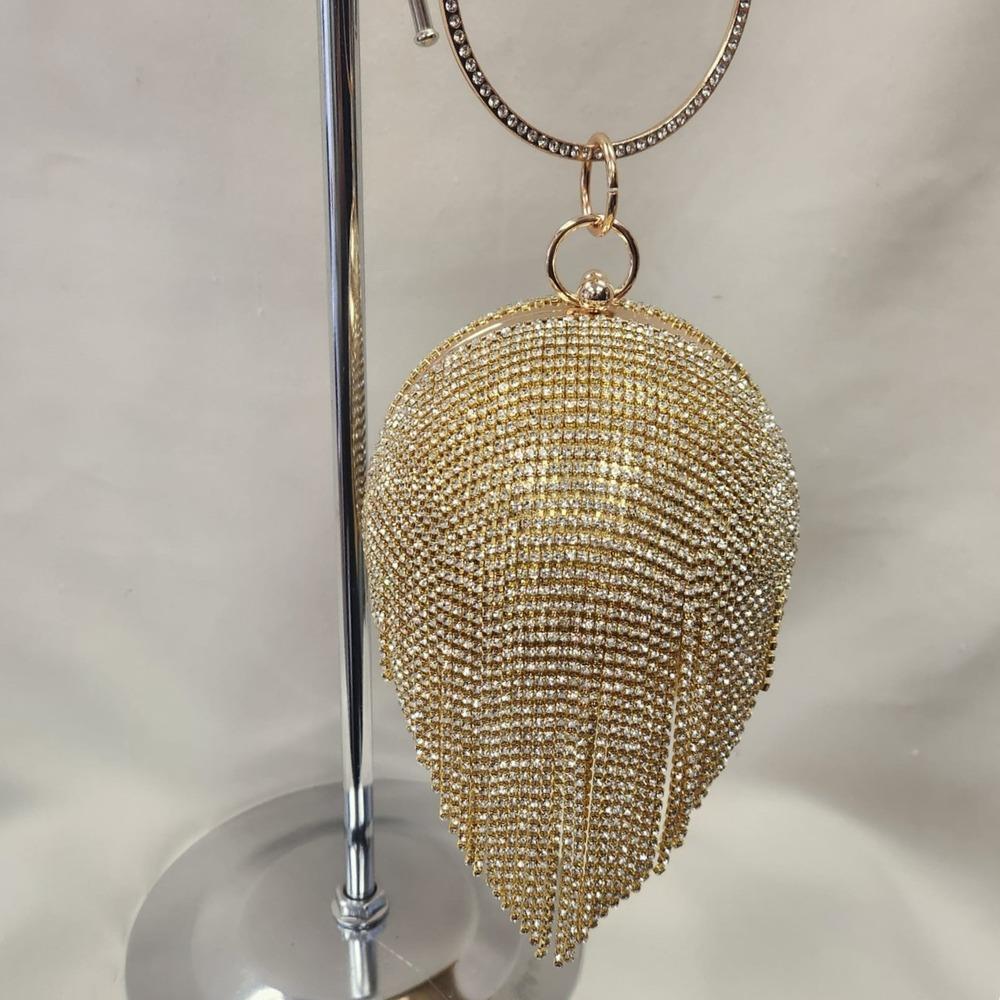Dangling tassels of gold globe shaped party purse