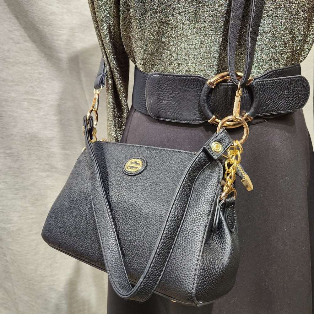 Close up view of black side bag with two straps
