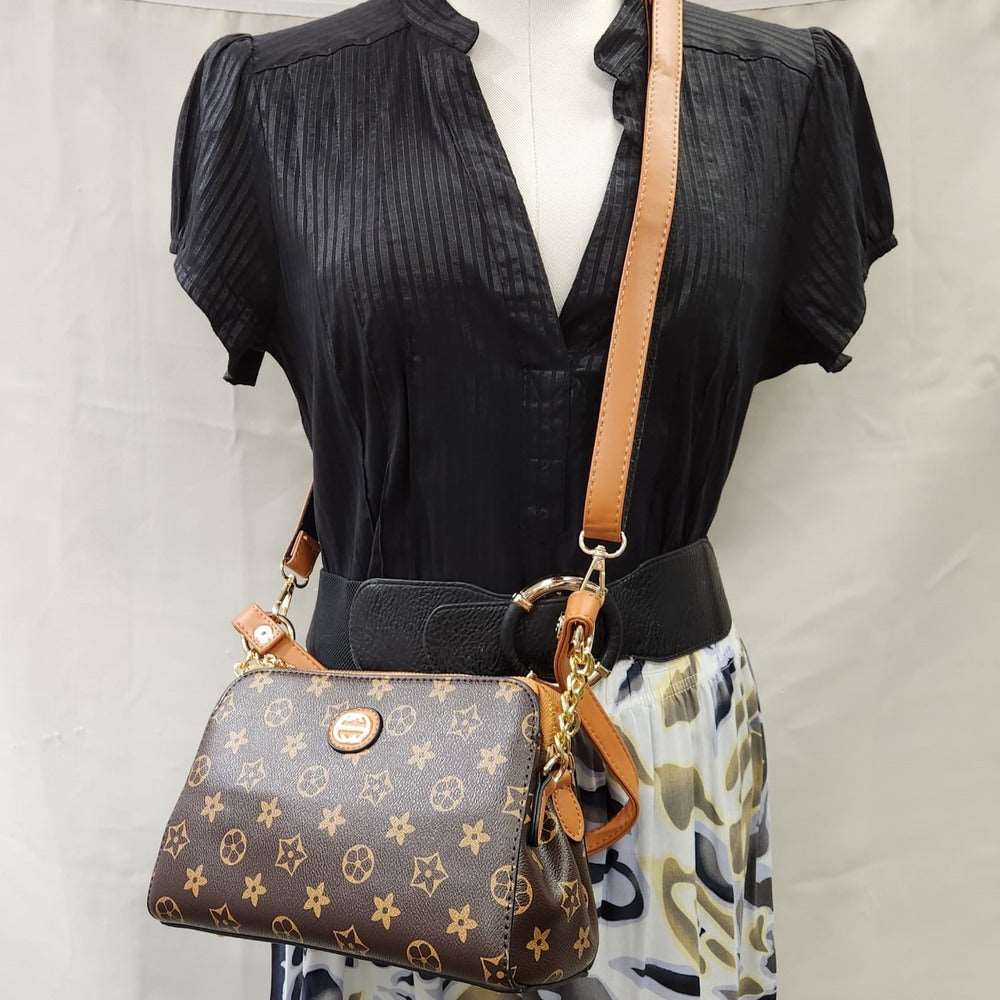 Brown and tan print side bag with multiple straps