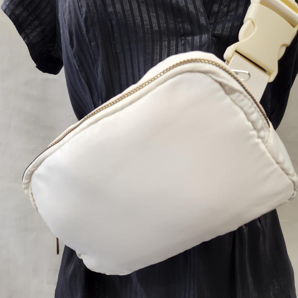 Closer view of Microfiber side bag in off white color