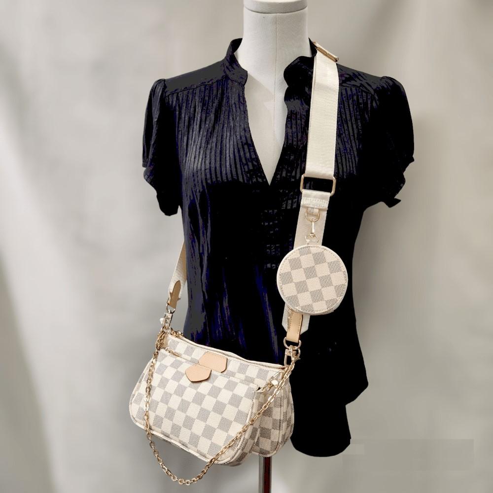 Full view of three piece side bag set in black & white checkered print