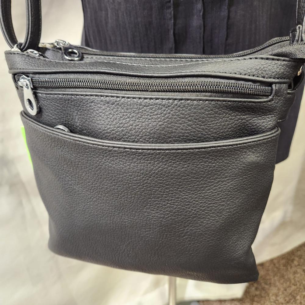 Detailed front view of Artificial leather side bag in black