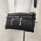 Detailed view of Black side bag with multiple pockets 