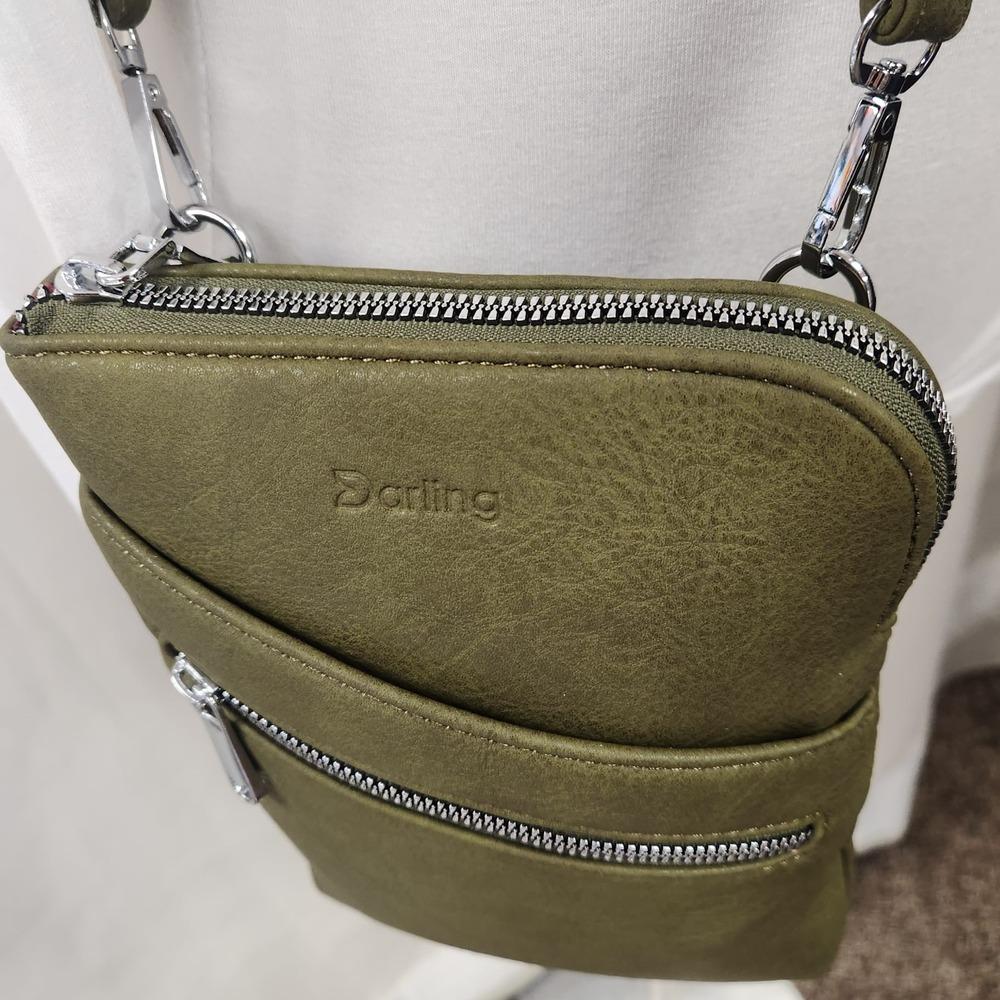 Zipper closure of small olive colored side bag