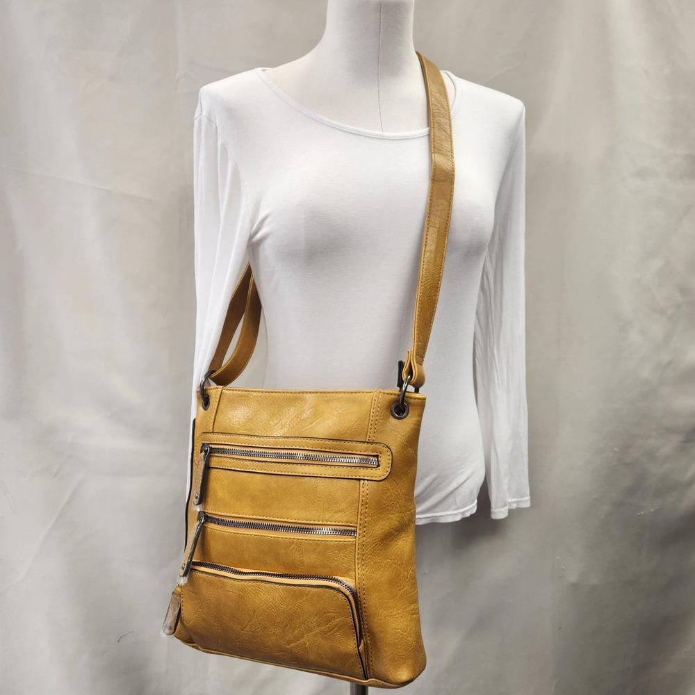 Messenger bag in light brownish yellow with multiple pockets