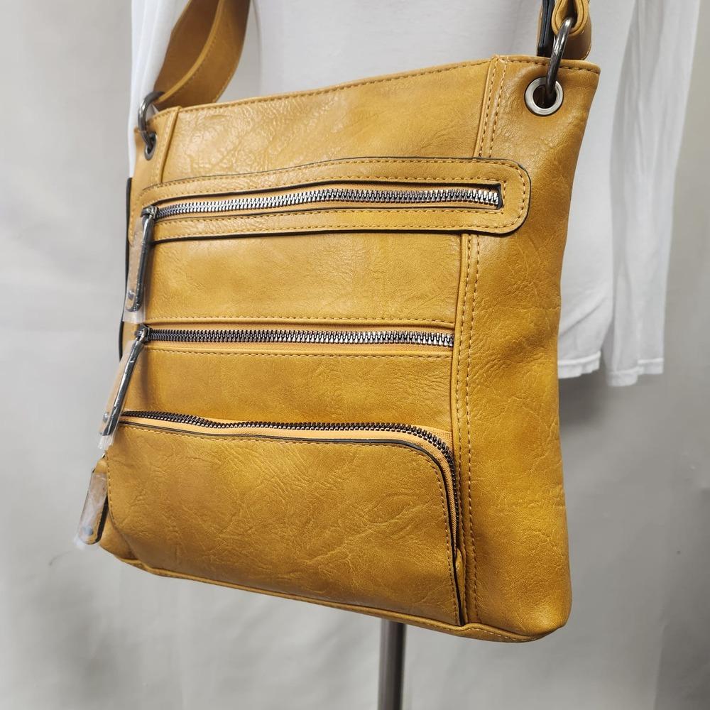 Detailed front view of Messenger bag in light brownish yellow color