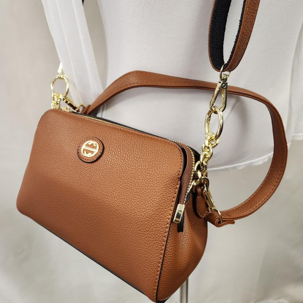 Detailed front view of Tan side bag with two straps