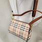 Detailed view of Plaid pattern side bag with brown straps