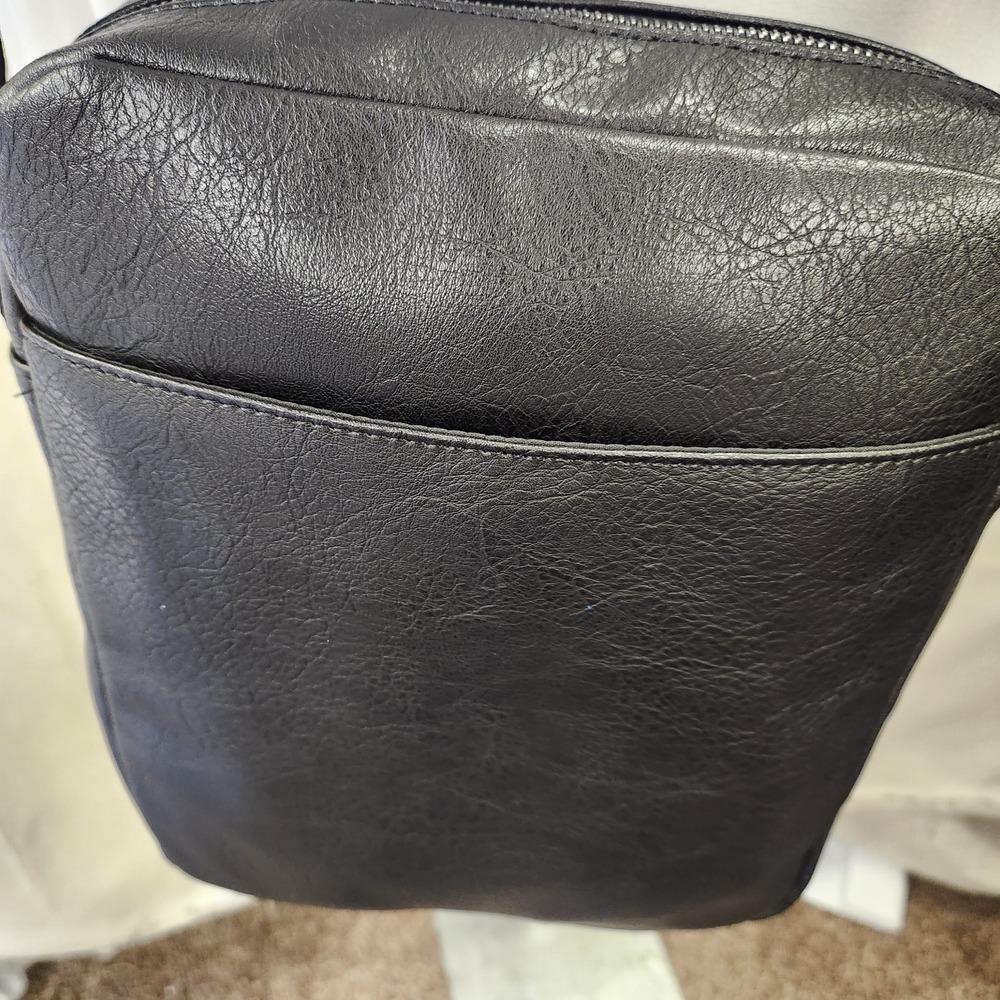 Rear view of Black color multiple pocket side bag