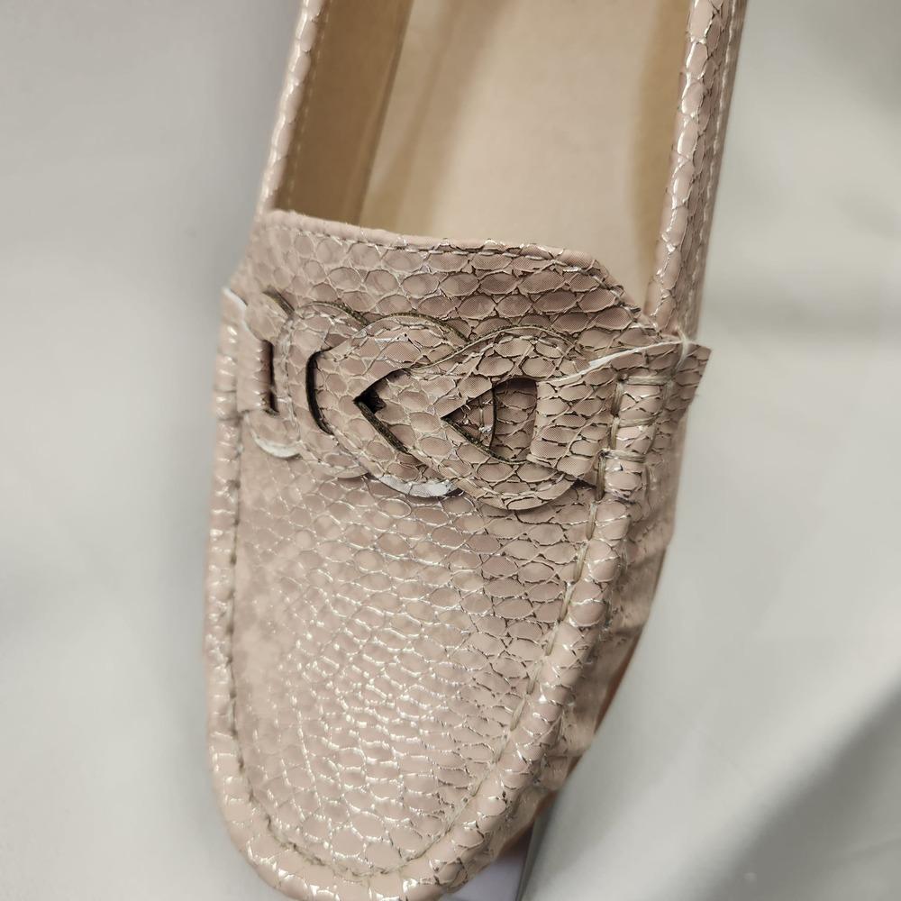 Detailed front view of Champagne color textured flat shoes for women