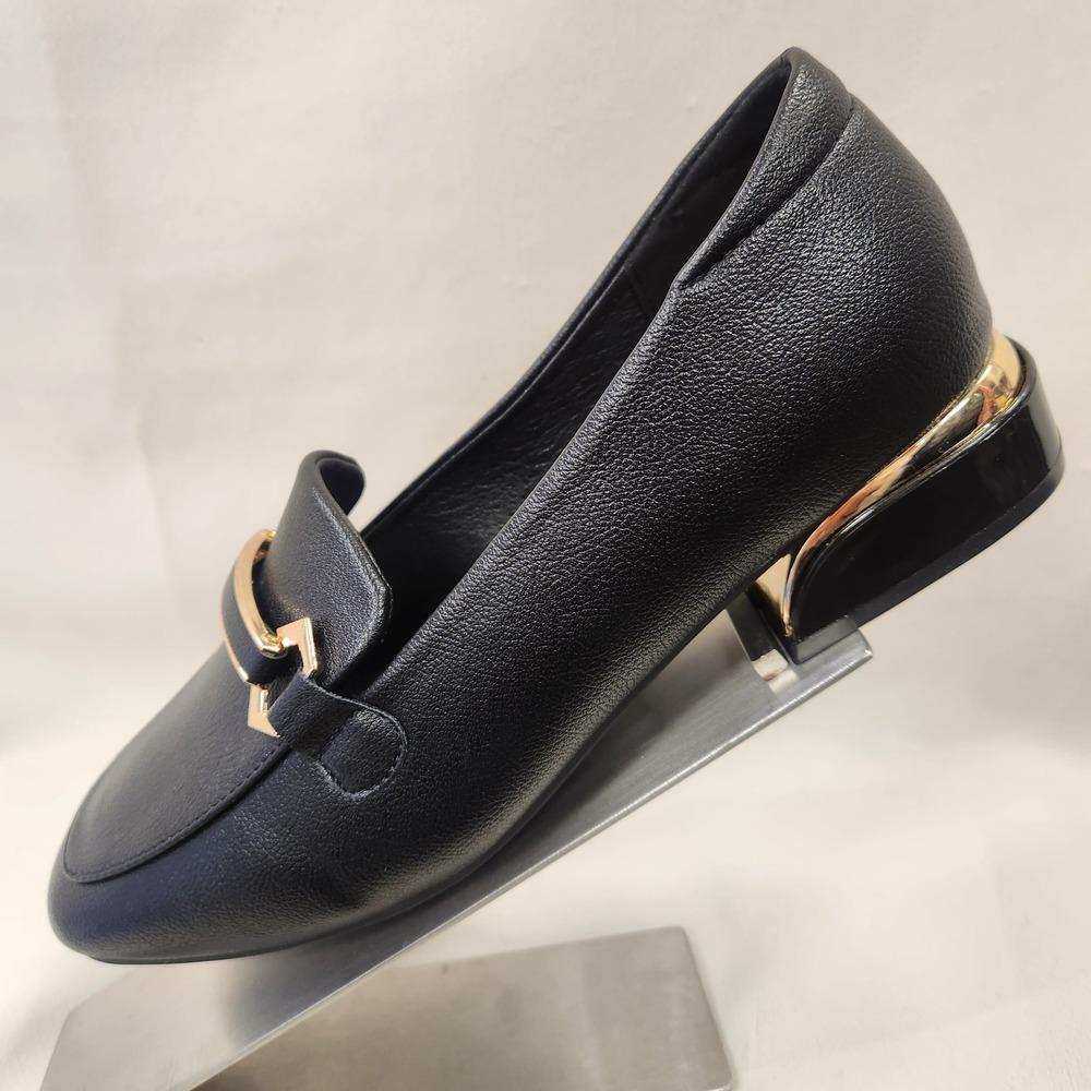 Side view of Fancy black flat shoes for women with gold trim 