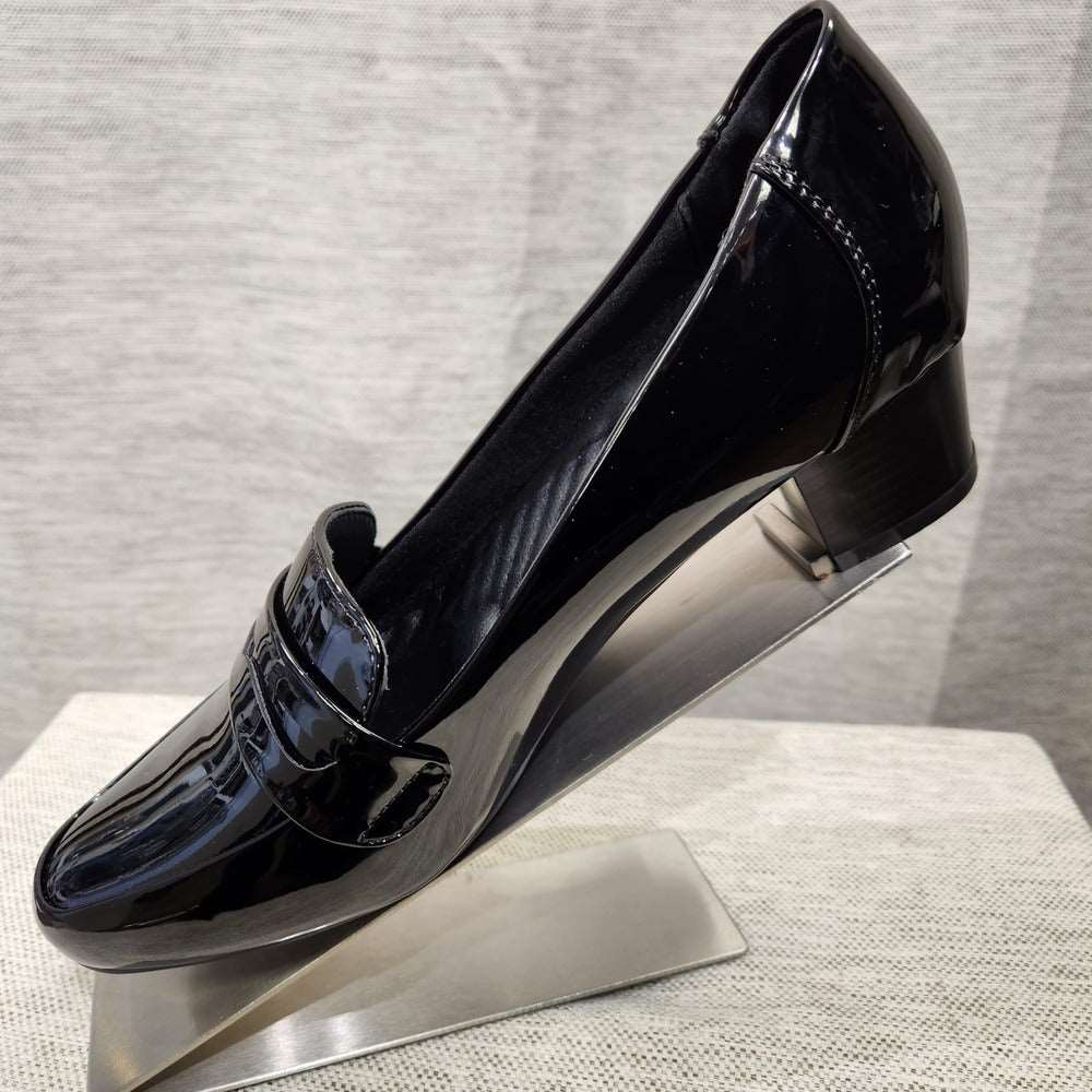 Side view black patent pumps with small broad heels