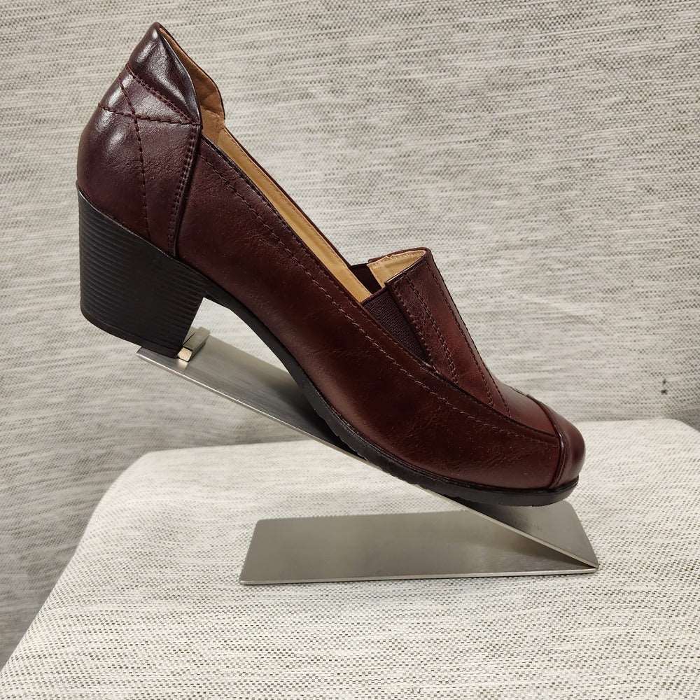 Side view of Burgundy shade pumps with padded sole