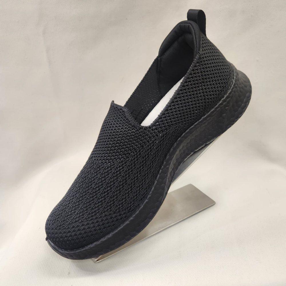 Side view of Black light weight slip on runners for women