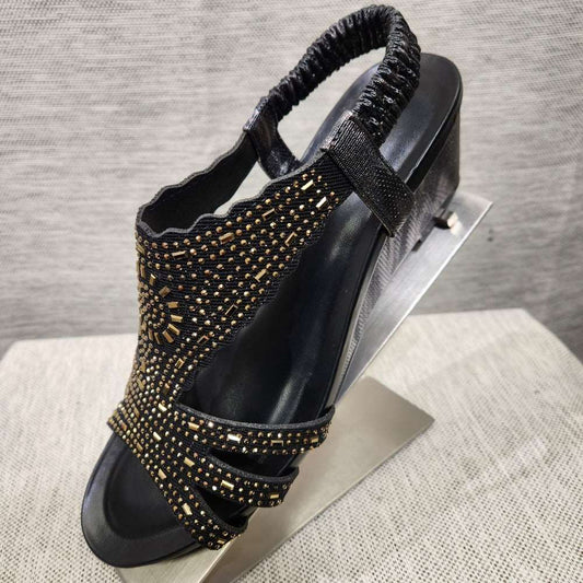 Black upper summer sandals embellished with gold color stones