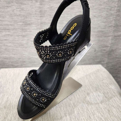 Black sandals with stone embellished upper straps